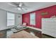 Charming bedroom featuring red accent wall, creating a cozy retreat, complete with warm rug and a -sized bed at 242 Weathers Farm Rd, Bowman, SC 29018