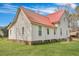 Rear side view of the home with a red roof and white siding at 242 Weathers Farm Rd, Bowman, SC 29018