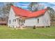 Charming two-story home with a red roof and well-maintained lawn at 242 Weathers Farm Rd, Bowman, SC 29018