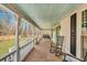 Inviting front porch with rocking chair and wooden floors at 242 Weathers Farm Rd, Bowman, SC 29018