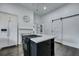 Modern kitchen with a center island, white cabinets, and sleek appliances, perfect for cooking and entertaining in style at 242 Weathers Farm Rd, Bowman, SC 29018