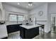 Modern kitchen features a center island and an open layout, seamlessly blending style and functionality for culinary experiences at 242 Weathers Farm Rd, Bowman, SC 29018