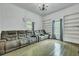 Spacious living room with large windows, classic hardwood floors, and custom built-in shelving at 242 Weathers Farm Rd, Bowman, SC 29018