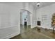 Bright, airy living room featuring an arched doorway and unique hardwood floors at 242 Weathers Farm Rd, Bowman, SC 29018