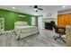 Cozy main bedroom with a decorative fireplace, hardwood floors, and natural light at 242 Weathers Farm Rd, Bowman, SC 29018