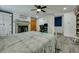 Spacious main bedroom features a cozy fireplace, ceiling fan, and an adjacent office space, offering comfort and functionality at 242 Weathers Farm Rd, Bowman, SC 29018