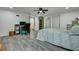 Large bedroom featuring hardwood floors, a ceiling fan and adjacent desk area with ample space, perfect for relaxation or work at 242 Weathers Farm Rd, Bowman, SC 29018
