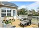 Relaxing back deck with outdoor seating, a white railing, and decorative planters at 2788 Carolina Isle Dr, Mount Pleasant, SC 29466