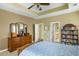 Serene bedroom showcasing natural light, soft carpet, and views into the ensuite bathroom at 2788 Carolina Isle Dr, Mount Pleasant, SC 29466
