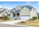 Traditional two-story home with a front porch, two-car garage and a well-maintained yard at 2788 Carolina Isle Dr, Mount Pleasant, SC 29466
