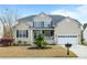 Charming home with a two-car garage, a covered front porch, manicured lawn and a nice garden at 2788 Carolina Isle Dr, Mount Pleasant, SC 29466