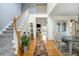 Inviting foyer with staircase, wood floors, and an open view to the dining and living areas at 2788 Carolina Isle Dr, Mount Pleasant, SC 29466