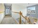 Bright upstairs hallway with carpet, chandelier, and natural light from a large window at 2788 Carolina Isle Dr, Mount Pleasant, SC 29466