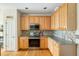 Functional kitchen featuring wooden cabinets, stainless steel appliances and granite countertops at 2788 Carolina Isle Dr, Mount Pleasant, SC 29466