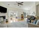 Spacious living room showcasing French doors, a fireplace, and access to the dining area at 2788 Carolina Isle Dr, Mount Pleasant, SC 29466
