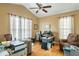 Well lit home office boasts hardwood floors, ceiling fan, and large desk area at 2788 Carolina Isle Dr, Mount Pleasant, SC 29466