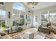 Bright sunroom featuring large windows and comfortable seating, perfect for relaxation at 2788 Carolina Isle Dr, Mount Pleasant, SC 29466
