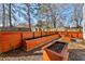 The backyard features tiered garden beds built of wood sitting on gravel at 2915 Nantuckett Ave, North Charleston, SC 29420