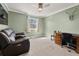 Bedroom with green walls features a window, desk, and comfy recliner with overhead lighting at 2915 Nantuckett Ave, North Charleston, SC 29420