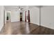 Bright bedroom features hardwood floors, ceiling fan, closet, and a window with red curtains at 2915 Nantuckett Ave, North Charleston, SC 29420
