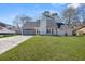 Charming single-Gathering home with a well-manicured lawn and an attached two-car garage at 2915 Nantuckett Ave, North Charleston, SC 29420