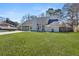 Charming single-story home with a well-maintained lawn and attached two-car garage at 2915 Nantuckett Ave, North Charleston, SC 29420