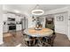 Eat-in kitchen featuring stainless steel appliances, white cabinetry, and modern lighting at 2915 Nantuckett Ave, North Charleston, SC 29420