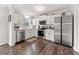 Modern kitchen with stainless steel appliances, white cabinets, and hardwood flooring at 2915 Nantuckett Ave, North Charleston, SC 29420