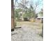 Spacious backyard with mature trees, fenced perimeter, and storage shed, offering a private outdoor retreat at 313 Springwood Dr, Walterboro, SC 29488