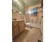Functional bathroom with a single sink vanity, tiled shower, bathtub combination, and standard toilet at 313 Springwood Dr, Walterboro, SC 29488