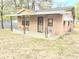 Charming one-story home featuring a covered front porch with seating area and an ADT security system at 313 Springwood Dr, Walterboro, SC 29488