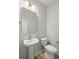 Half bath with white fixtures, decorative mirror and lighting at 3154 Vanessa Lynne Ln, Johns Island, SC 29455