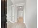 Bright entryway showcasing light hardwood floors, white walls, and a black front door at 3154 Vanessa Lynne Ln, Johns Island, SC 29455