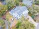 Charming aerial view of a home with a large deck, beautiful pool and expansive yard at 3204 Waterway Blvd, Isle of Palms, SC 29451