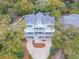 Beautiful aerial view of a charming home, showcasing its lush surroundings and inviting curb appeal at 3204 Waterway Blvd, Isle of Palms, SC 29451