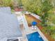 Aerial view of pool with lounge chairs and umbrella in the backyard of the home at 3204 Waterway Blvd, Isle of Palms, SC 29451