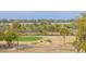 An aerial view overlooks the backyard, and trees with waterway in the distance at 3204 Waterway Blvd, Isle of Palms, SC 29451