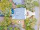 Aerial view of home with a pool, well manicured lawn and curved driveway at 3204 Waterway Blvd, Isle of Palms, SC 29451