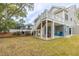 Beautiful backyard showcasing the deck, stairs, and patio at 3204 Waterway Blvd, Isle of Palms, SC 29451