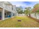 Sprawling backyard with well maintained lawn, trees, and beach toys for the  at 3204 Waterway Blvd, Isle of Palms, SC 29451