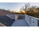 Rooftop balcony showcases sunset views, rooftop access, and unique decorative privacy panels at 3204 Waterway Blvd, Isle of Palms, SC 29451