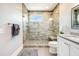 Bathroom featuring large glass shower with bench, light countertops, and modern fixtures at 3204 Waterway Blvd, Isle of Palms, SC 29451