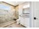 Bathroom featuring large glass shower with bench, light countertops, and modern fixtures at 3204 Waterway Blvd, Isle of Palms, SC 29451