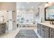 Luxurious bathroom with a freestanding tub, walk-in shower, and double vanity sinks at 3204 Waterway Blvd, Isle of Palms, SC 29451