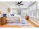 Bedroom featuring a king bed, wood floors, a ceiling fan, and serene natural light from multiple windows at 3204 Waterway Blvd, Isle of Palms, SC 29451