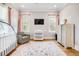 Bright Bedroom features two windows, crib, accent chair, area rug, dresser, and changing table at 3204 Waterway Blvd, Isle of Palms, SC 29451