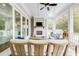 Inviting covered patio with plush seating, a fireplace, and a seamless indoor-outdoor flow, perfect for relaxation and entertaining at 3204 Waterway Blvd, Isle of Palms, SC 29451