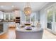 Dining room showcasing a table with decorative chairs, pendant light, and views to the outside at 3204 Waterway Blvd, Isle of Palms, SC 29451