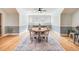 Inviting dining room with ample natural light, a round table, and stylish decor on a blue rug at 3204 Waterway Blvd, Isle of Palms, SC 29451