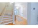 Bright entryway boasts hardwood floors, staircase, and decorative lighting fixture at 3204 Waterway Blvd, Isle of Palms, SC 29451